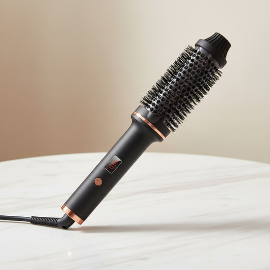 Arya Lush 3-in-1 hot air brush in matte black with rose gold accents and an oval barrel for volumizing hair styling.